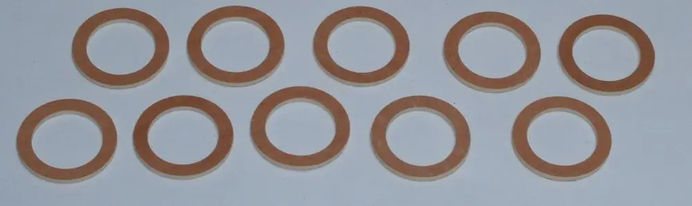 Daikin Flachdichtungen in Form von runden Ringen, jeweils mit einem offenen Innenloch, auf hellem Hintergrund angeordnet. Ideal für Dichtungsanwendungen.